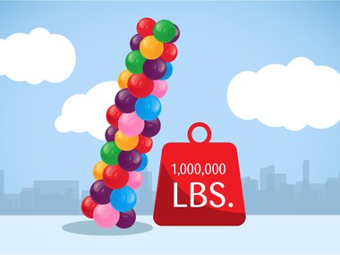 Illustration of multicolored balloons next to a 1,000,000 pound weight