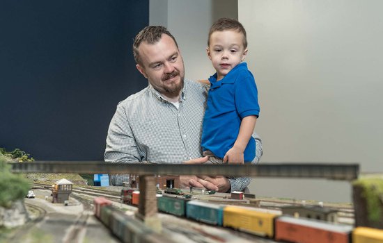 adult and child observing a model rail road display.jpg