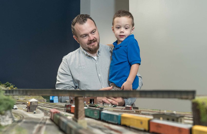adult and child observing a model rail road display.jpg