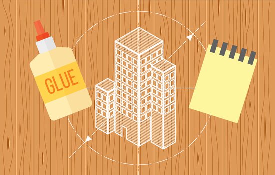 An illustration of a design for a building on top of a wooden background. Also illustrated is a glue bottle and a note pad.