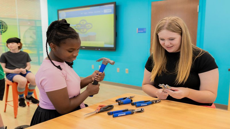 young females using tools in the creativity lab